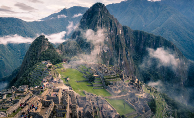 Overview image of peru - inca village with mountains in the clouds